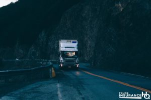 a truck driving in the dark